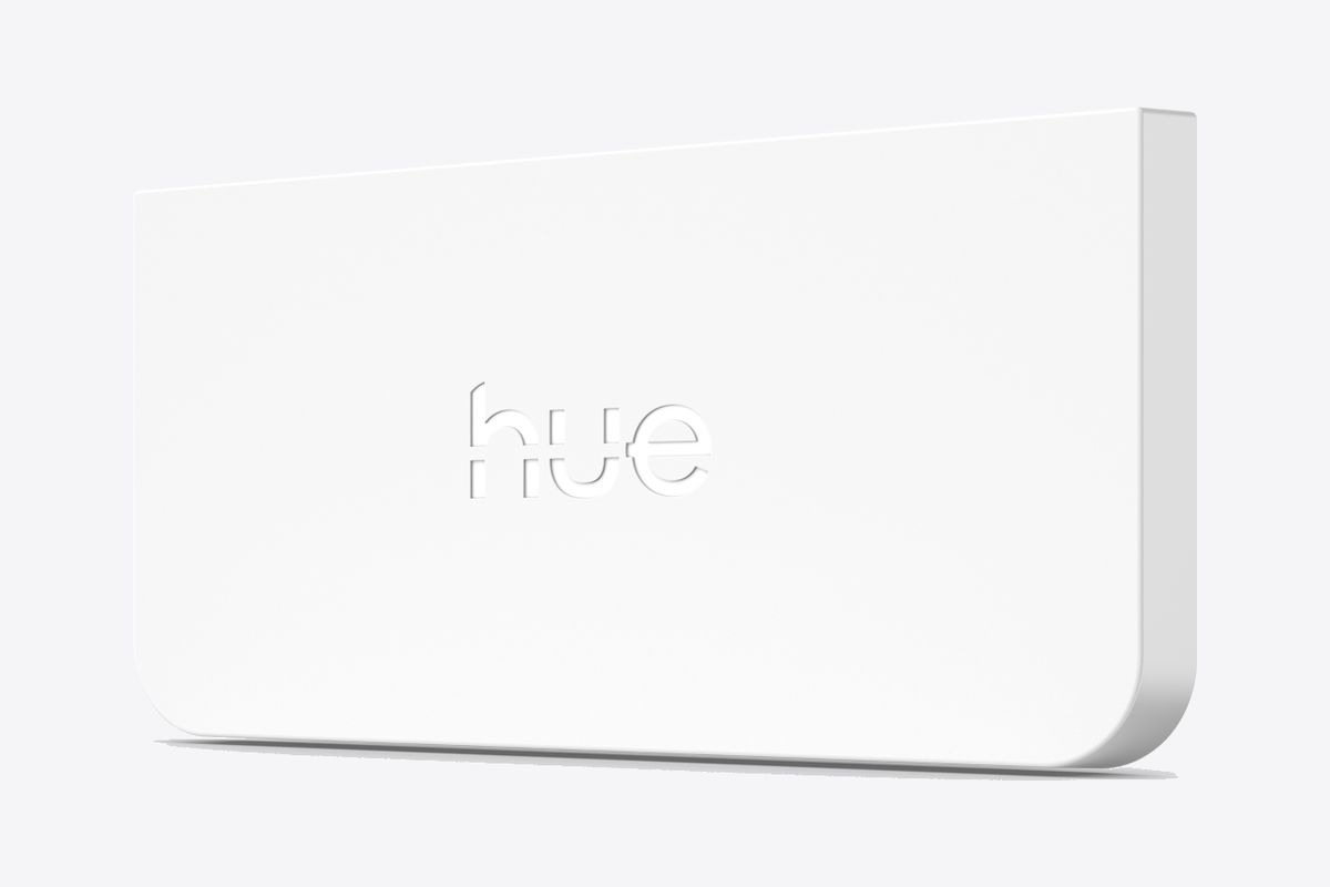 White Philips Hue wall light module with the Hue logo