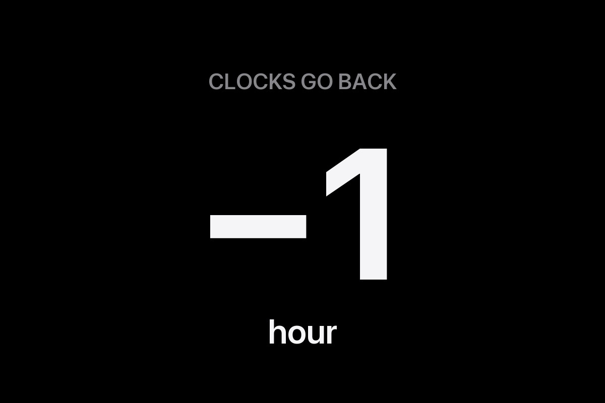 Clocks go back, minus one hour, lettering on a black background